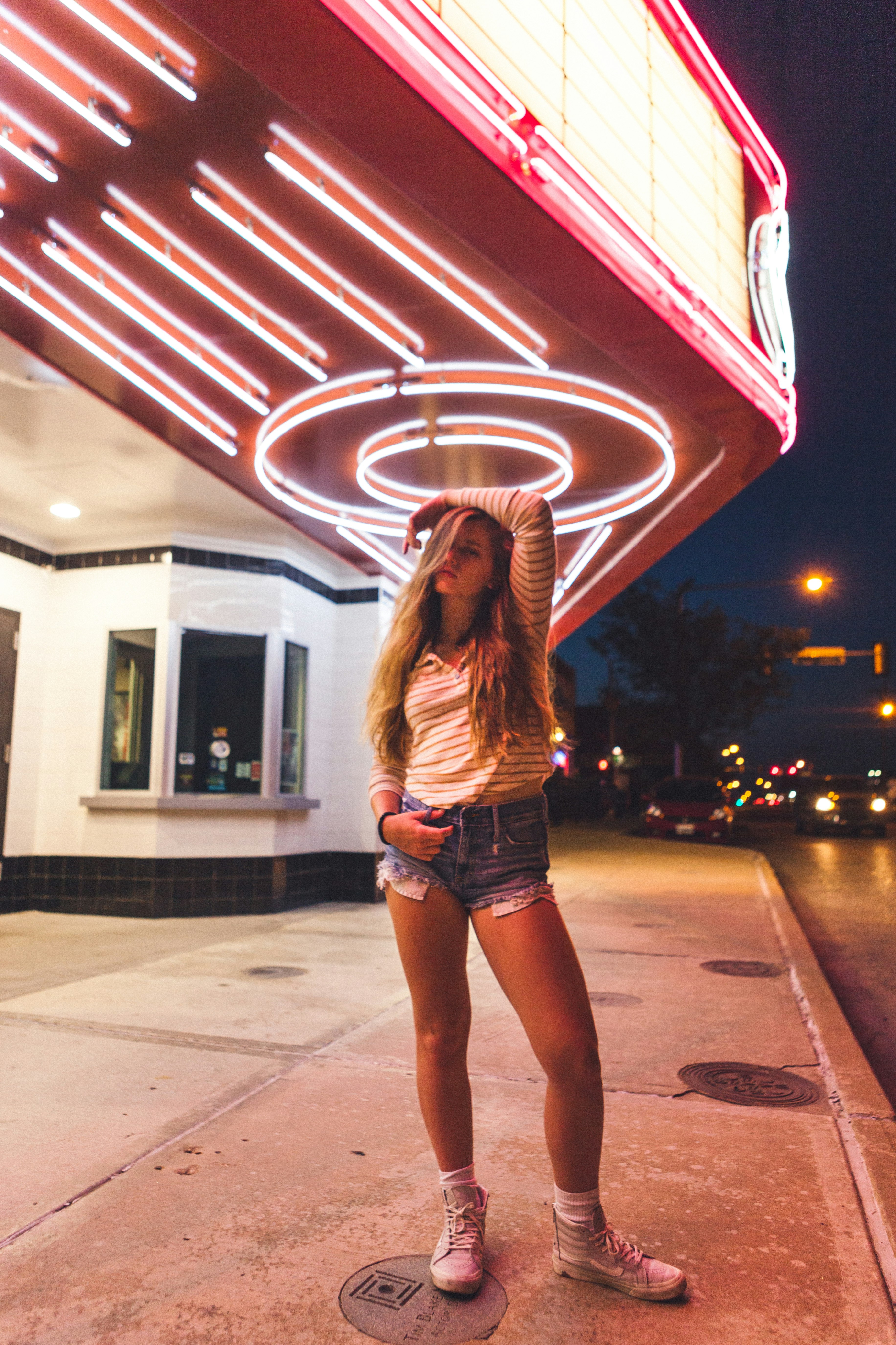 woman standing near building